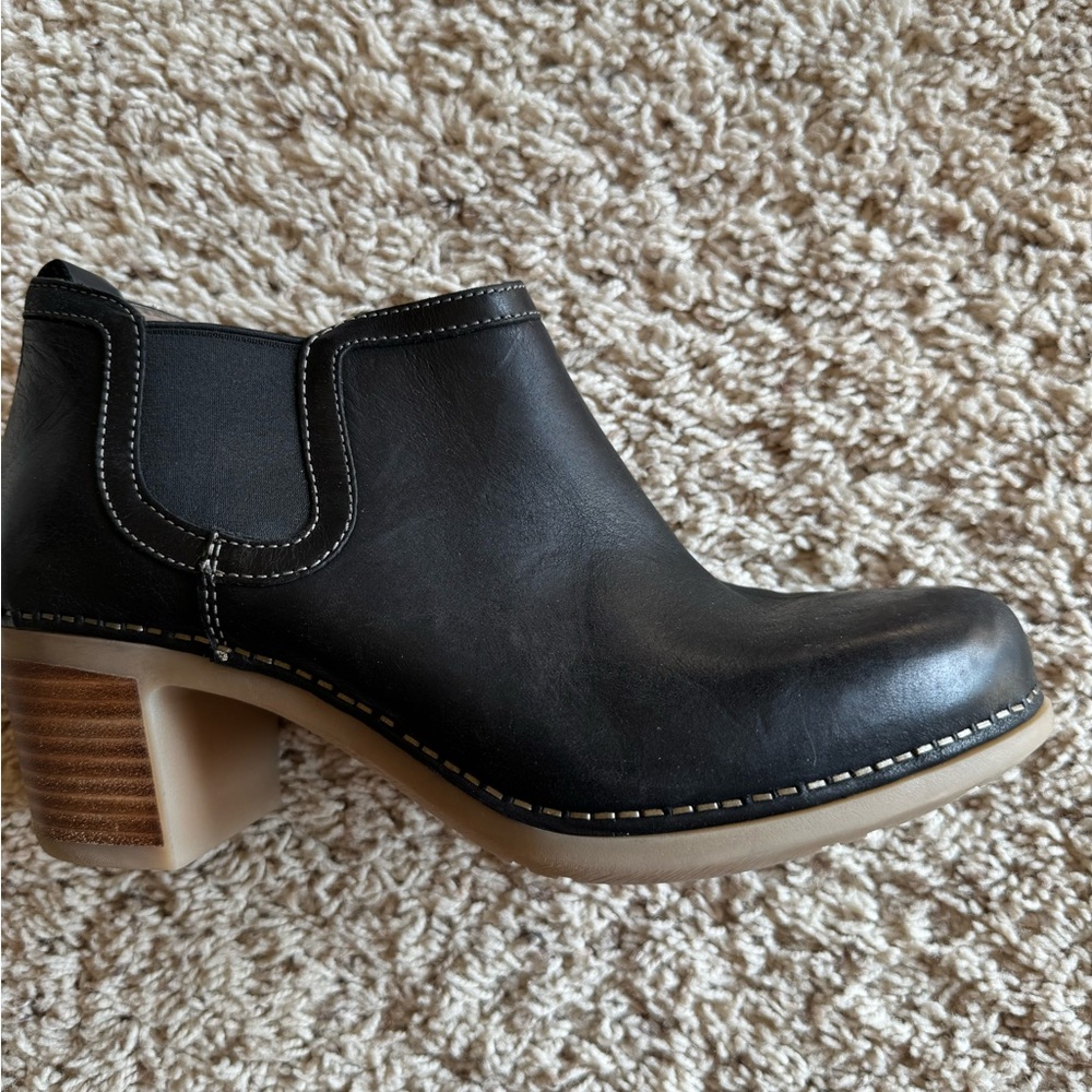 Black Dansko leather booties with crepe sole and wood block heel. Size 38.